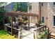 Outdoor kitchen with pergola and seating area at 3173 Woodrow Ne Way, Brookhaven, GA 30319