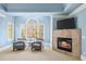 Bedroom sitting area with fireplace and comfy chairs at 3173 Woodrow Ne Way, Brookhaven, GA 30319