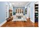 Cozy sitting area with fireplace, built-in shelving, and hardwood floors at 3173 Woodrow Ne Way, Brookhaven, GA 30319