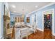 Bright sitting room with a stone fireplace and built-in shelving at 3173 Woodrow Ne Way, Brookhaven, GA 30319