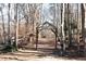 Wooded trail entrance with a wooden archway and informational kiosk at 3173 Woodrow Ne Way, Brookhaven, GA 30319