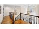 Upstairs hall with hardwood floors and elegant railings at 3173 Woodrow Ne Way, Brookhaven, GA 30319