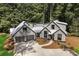 Modern farmhouse with metal roof and a spacious driveway at 1544 Bullard Rd, Powder Springs, GA 30127