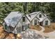 Modern home with metal roof and two-car garage, aerial view at 1544 Bullard Rd, Powder Springs, GA 30127