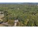 Home surrounded by lush trees and landscape, offering privacy at 1544 Bullard Rd, Powder Springs, GA 30127