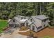 Stylish home nestled in a wooded setting, showcasing a metal roof at 1544 Bullard Rd, Powder Springs, GA 30127