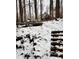 Snowy backyard with deck and stairs leading to home at 1544 Bullard Rd, Powder Springs, GA 30127
