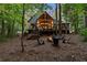 Home with firepit and wooded backyard at 1544 Bullard Rd, Powder Springs, GA 30127