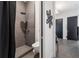 Clean bathroom with walk-in shower and dark gray tile at 1544 Bullard Rd, Powder Springs, GA 30127