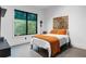 Charming bedroom featuring a large window and modern decor at 1544 Bullard Rd, Powder Springs, GA 30127