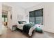 Cozy bedroom with a green velvet comforter and large window with window shades at 1544 Bullard Rd, Powder Springs, GA 30127