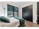 Serene bedroom with green velvet accents and large window with window shades at 1544 Bullard Rd, Powder Springs, GA 30127