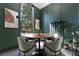 Modern dining area with round table and green accent wall at 1544 Bullard Rd, Powder Springs, GA 30127