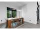 Modern dining area with wood table and metal chairs near window at 1544 Bullard Rd, Powder Springs, GA 30127