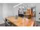 Open concept dining area with long wooden table and modern chairs at 1544 Bullard Rd, Powder Springs, GA 30127