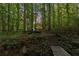 Footbridge leading to a deck and home in the woods at 1544 Bullard Rd, Powder Springs, GA 30127