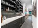 Butler's pantry with dark cabinetry and quartz countertops at 1544 Bullard Rd, Powder Springs, GA 30127
