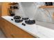 Modern kitchen features gas cooktop and marble countertops at 1544 Bullard Rd, Powder Springs, GA 30127