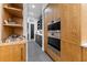 Modern kitchen with built-in oven and wood cabinetry at 1544 Bullard Rd, Powder Springs, GA 30127