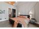 Main bedroom with a king-size bed and access to the bathroom at 1544 Bullard Rd, Powder Springs, GA 30127