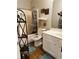 Clean bathroom with a tub, shower, and white vanity at 1077 Balvaird Dr, Lawrenceville, GA 30045