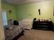 Upstairs bedroom with a crib and zebra patterned bedding at 1077 Balvaird Dr, Lawrenceville, GA 30045