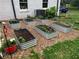 Backyard with raised garden beds and wood chips at 1430 New Hope Church Rd, Loganville, GA 30052