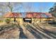 Rustic barn with weathered metal roof, offering storage potential at 1430 New Hope Church Rd, Loganville, GA 30052