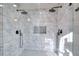 Spa-like bathroom with double shower heads and marble tile at 1430 New Hope Church Rd, Loganville, GA 30052