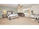 Spacious bedroom with large window, plush carpeting, and built-in bench at 1430 New Hope Church Rd, Loganville, GA 30052