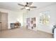 Bright bedroom with a desk and built-in shelving, offering a functional workspace at 1430 New Hope Church Rd, Loganville, GA 30052