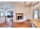 Whitewashed brick fireplace accents this charming dining area at 1430 New Hope Church Rd, Loganville, GA 30052