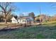 Rear view of the house with garden and fencing at 1430 New Hope Church Rd, Loganville, GA 30052