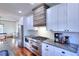 Modern kitchen with stainless steel appliances and granite countertops at 1430 New Hope Church Rd, Loganville, GA 30052