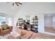 Living room boasts hardwood floors, a modern entertainment center, and white brick accent wall at 1430 New Hope Church Rd, Loganville, GA 30052