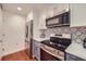 Stainless steel appliances and blue cabinets at 230 E Ponce De Leon Ave # 219, Decatur, GA 30030