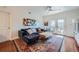 Bright living room with hardwood floors, comfy sectional sofa, and access to a balcony at 230 E Ponce De Leon Ave # 219, Decatur, GA 30030