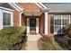 Front entry with stone flooring and landscaping at 2490 Insdale Nw Trce, Acworth, GA 30101