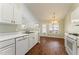 Kitchen with white cabinets, a breakfast nook, and hardwood floors at 2490 Insdale Nw Trce, Acworth, GA 30101