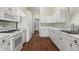 Galley kitchen, white cabinets, new flooring, and appliances at 2490 Insdale Nw Trce, Acworth, GA 30101