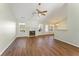 Living room with hardwood floors, fireplace, and ceiling fan at 2490 Insdale Nw Trce, Acworth, GA 30101