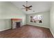 Living room with stone fireplace and ceiling fan at 2490 Insdale Nw Trce, Acworth, GA 30101