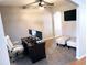 Bright home office features a wood desk, comfortable chair and two monitors at 500 Gristmill Ln, Hampton, GA 30228