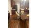 Kitchen with dark wood cabinets and glass table at 500 Gristmill Ln, Hampton, GA 30228