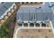 Aerial view of townhouses; showing building exteriors, landscaping, and parking at 5215 Riden Ct, Buford, GA 30518