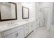 Double vanity bathroom with marble flooring and a separate shower at 5215 Riden Ct, Buford, GA 30518