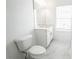 Clean bathroom with white vanity, marble floor, and window at 5215 Riden Ct, Buford, GA 30518