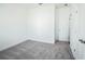 Spacious bedroom with grey carpet and a door at 5215 Riden Ct, Buford, GA 30518