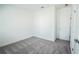 Spacious bedroom with grey carpet and a door at 5215 Riden Ct, Buford, GA 30518