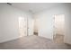 Spacious bedroom with gray carpeting and ample closet space at 5215 Riden Ct, Buford, GA 30518